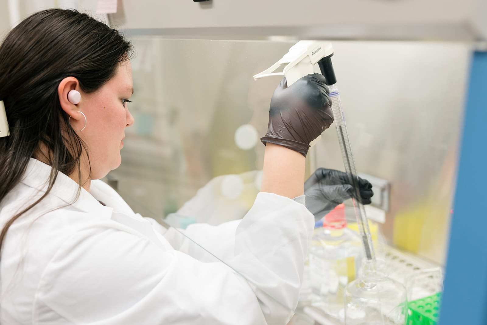 Down syndrome researcher processing biospecimens in lab