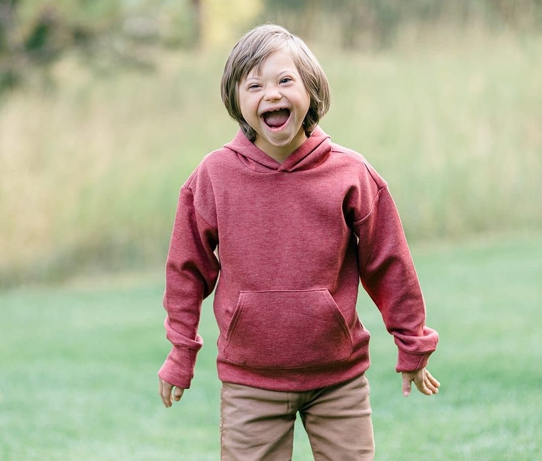 Young boy with Down syndrome laughing